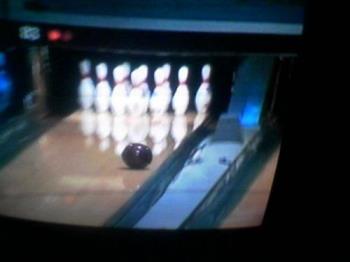 Bowling - Bowling pins about to get hit.