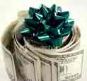 roll of money with a green holiday bow - this roll of money significant during the holiday season when many go into debt and then worry over the bills