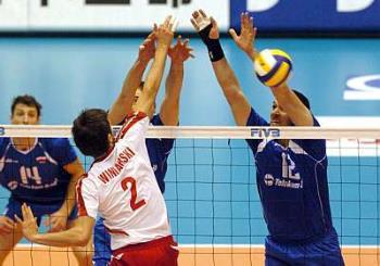 voleybal - players dividing the ball in the net