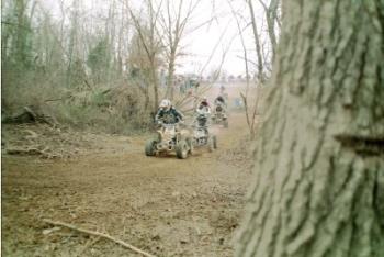 Holeshot! - In racing, whoever has the lead off the starting line has the "holeshot". This is a picture of my husband with the holeshot at a race in Budds Creek, Maryland.