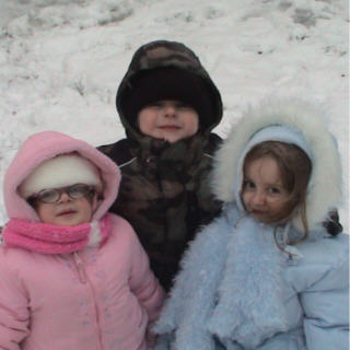 My kids in the snow last December (2005) - Don&#039;t they look all toasty in their new snow gear.  It was the first year they each had a matching set of snow gear from their hats to their boots.