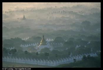 Kuthodaw Paya at sunrise. Mandalay, Myanmar  - Founded on 23 May 1859 by King Mindon Min[1], Mandalay was the last capital (1860–1885) of the last independent Burmese Kingdom before annexation by the British after the Third Anglo-Burmese War in 1885.

Unlike other Burmese towns, Mandalay did not grow from a smaller settlement to town proportions although there did exist a village by the name of Htee Baunga nearby. Mandalay was set up in an empty area at the foot of 236 meter Mandalay Hill according to a prophecy made by the Buddha that in that exact place a great city, a metropolis of Buddhism, would come into existence on the occasion of the 2,400th jubilee of Buddhism.

