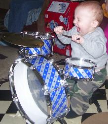 Try this with 5 kids and 1 newborn... :) - AA 13 mths old first Drum Set.