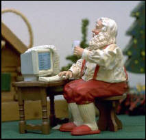 santa and his computer - see santa is hard at work and uses a computer too.