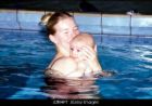 mom and baby - this is a perfect example of a mom teaching her child how to swim, or at least not be afraid of the water. you dont want to develope a phobia. 
