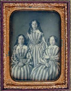 striped dresses - Three women in striped dresses