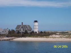 heres a photo i took from a whale watch boat.. - This lighthouse made for a nice picture..