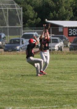 Baseball Game - This shot was taken with a Canon  ESO 20D using the Kit Lense 18-70 mm lense.  I was in the dougout and thei action took place in Right Center Feild.  I croppen the photo down to a 5x7 and you can see that the ball is about to enter the glove and the 2nd baseman is copmming up short allowing the center fielder to make the catch.  The very short lag time makes capturing the photo much easier.