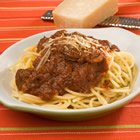 spaghetti with tomato and sausage sauce - ingredients
1 pound beef sausage 
1 onion, minced 
2 cups fresh sliced mushrooms 
1/4 cup olive oil 
2 (6 ounce) cans tomato paste 
1 (46 fluid ounce) can tomato juice 
1 (16 ounce) can crushed tomatoes 
1 cup Burgundy wine 
1 1/2 tablespoons dried oregano 
1 tablespoon dried basil 
2 tablespoons dried parsley 
1 tablespoon minced garlic 
2 tablespoons garlic salt 
1/2 cup white sugar 
2 pounds spaghetti 

directions
preheat oven to 350 degrees F (175 degrees C). Cook sausage for 30 minutes. Cut into bite sized pieces, and set aside. 
in a dutch oven, saute onion and mushrooms in olive oil until tender. remove with slotted spoon, and set aside. stir into Dutch oven: tomato paste, tomato juice, Italian tomatoes, and wine. stir until smooth. mix in oregano, basil, parsley, garlic, garlic salt, and sugar. Return sausage and onion and mushroom saute to sauce. Bring to a boil. reduce heat, and simmer for at least 3 hours. cover pot if sauce becomes too thick. 

