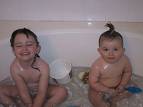 bathing - two child bathing in a bath room.