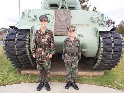 Young Marines by a Tank - Young Marines proud of our country and the military, standing in front of a Tank