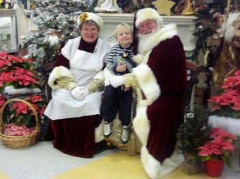 Mrs. Claus, Skylar and Santa - This was taken at Santa&#039;s workshop..dont they look beautiful? you can click on the picture to make it bigger..:)