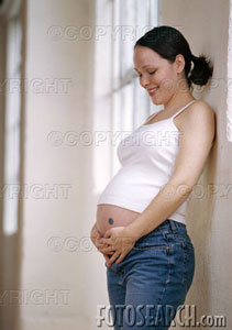 A pregnant woman. - A picture of a woman thats 8 months pregant.