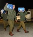 New Delivery of Depends - photo of men carrying packages of diapers aka depends