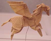 Paper Horse - The practice and study of origami encapsulates several subjects of mathematical interest. Using optimization algorithms, a circle-packing figure can be computed for any uniaxial base of arbitrary complexity. 