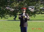 Playing Taps - photo of a bugler in uniform playing taps