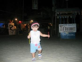 boy on the beach - a picture of our son running on the beach at night