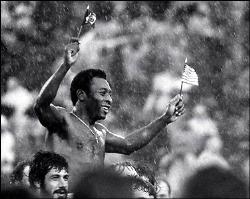 Pele, the legend - Waving the flags of Brazil and the U.S., Pele is carried off the field by players of both teams at Giants Stadium in East Rutherford, N.J., on Oct. 1, 1977 after his final game. Pele played for both teams in the exhibition — the New York Cosmos and Santos, his former team in Brazil