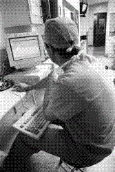 Desktop - Physician working on a desktop computer.
