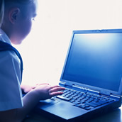 computing - a child working on a laptop