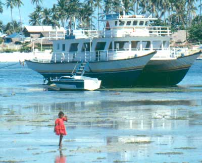Cebu -  A shot from Cebu with a view of a boat and a child.