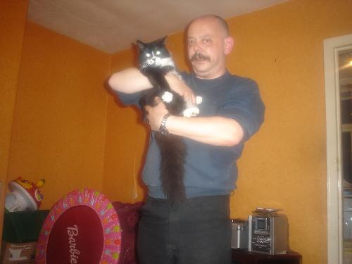 my husband bob and our sweet little tom cat - here is my cat guiness who keeps mounting my labrador and also has had a go at a lamp post, a chicken, a turkey (frozen) and a duck