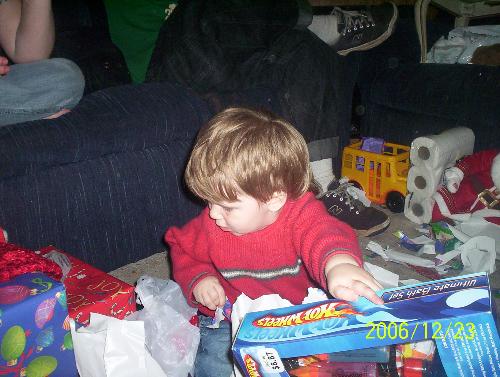 Mal opening Christmas gifts - My grandson Mal opening his Christmas gifts.