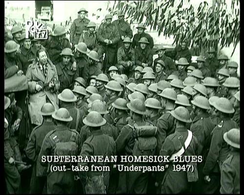 Bob Dylan plagiarist? - Early photo of George Formby performing 'Subterranean Homesick Blues' for our boys on the front
