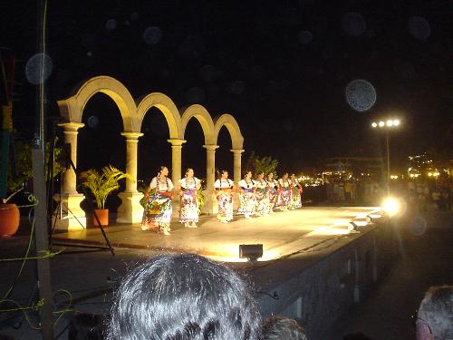 Malecon in Puerto Vallarta - This is the boardwalk (Malecon) along the main beachfront in downtown Puerto Vallarta. Almost every night there is some sort of event...if not just a variety of musicians, mimes and sand sculptors. At 9:00 each night, an old style Spanish galeon wooden ship cruises along the boardwalk and shoots off Disney style fireworks from the ship. The beach itself was in poor condition due to a hurricane last time I was there about 2 years ago, but that didn't seem to stop people from coming.