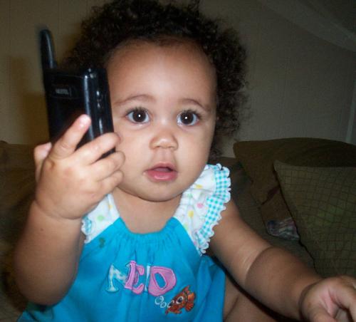 lil maddie - maddie at 8months trying to use the phone!