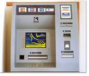 atm machine - Most people put their money in a bank where they can get it out atm machines as needed