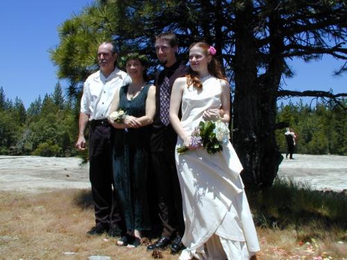 Our wedding day - My wife and I on our wedding day with my parents.  My mother married us out in the forest near Yosemite National Park in California.  The place is called Moon Rock and is the most magical of places.  We chose the rock for our wedding because it feels far more holy and pure than any church or building made by man's hands.  Our whole wedding cost us less than $1000 and was the best possible wedding we could have asked for.  Why do people need million dollar weddings just to stroke their egos?