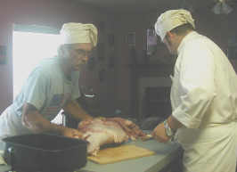 Cutting Up The Pig - Here my husband and son cut up the pig we raised for food. She dressed out at 300 lbs.