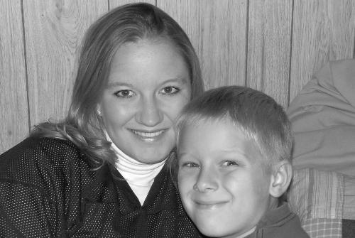 my son and I - This is a picture of my son and I, right before his 8th birthday party..of course I'm sporting the Vintage Notre Dame Fighting Irish football jersey my hubby bought me for MY birthday!! GO IRISH!!