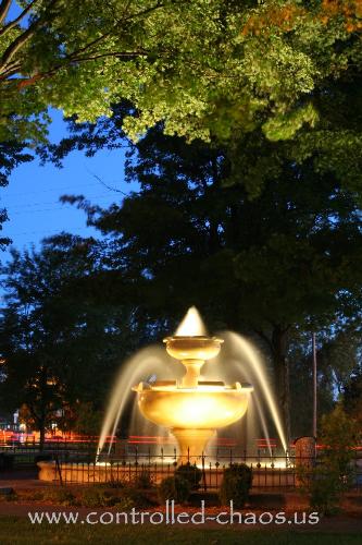 Fountain in city park - A night time shot of water fountain.  Taken in Cadillac, Michigan.  September 2006.