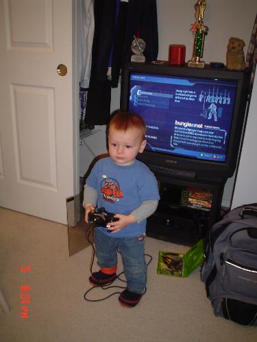 Brother With an Xbox Controller - My profile picture. My brother holding an Xbox controller.