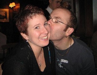 Me & my man:o) - Me and my other half, in December 2006.  I'd had long hair all my life, until I had chemo for breast cancer.  I loved my short hair when it grew back, because at least I had hair!