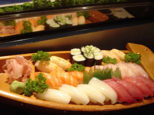 sushi boat - a colorful collection of the different kinds of sushis that i enjoy