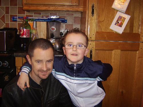 my son and husband - this is my son callum with my husband , callum is 8 and hes a very clever little boy ,he loves school and is very into football, playstation and reading .