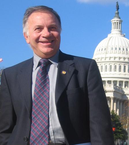 Tom Tancredo - Tom Tancredo standing in front of the US Capitol building in Washington DC.