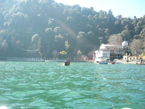 Boating in Nainital! - Nainital..basically known for three things:- 1. the Naini Lake 2. The Naina Devi temple 3. Candles.  The experience of boating at this place is totall out of the world. The picture is taken by me while i was in there with my friends on the boat. The water is so amazingly cold that it just freezes your hands for a couple of seconds. It surely is a Paradise on this Earth.