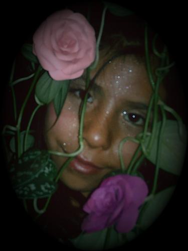 fearie sister - I just got a new camera and im working on my photagraphy skills, my little sister is my model for now, this pic was done with one of my moms plants inside the house