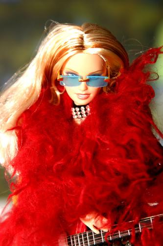 Barbie in an amusing red outfit - Yup, It's the ever fashionable, sexy, dazzling, elegantly crafted doll- Barbie!