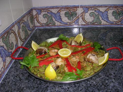 Paaella de Mariscos - A seafood paella (paella de mariscos o paella andaluza) that I made recently.  It contains rice, fish, assorted shellfish, green peas and, of course, saffron.  Enjoy a crisp white Spanish wine with it such as Marques de Caceres or Vinasol with it.