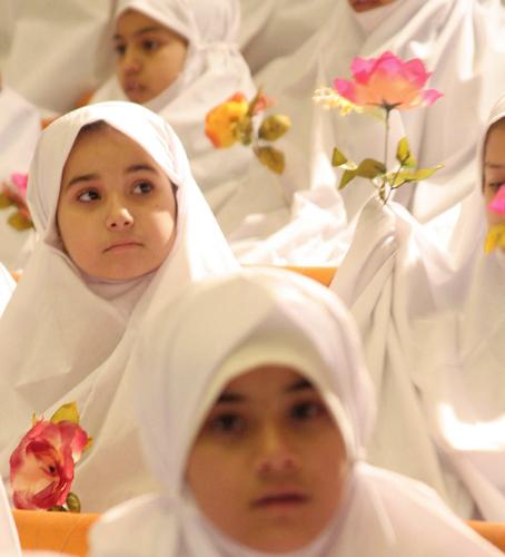 Iraq girls ceremony - In Iraq when muslims girls reached age 9 then they gather in ceremony where they get white scraf on head and carry flowers in hand that mean now they are becoming in  young adults ages.