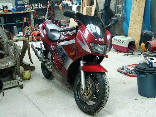my husbands pride and joy - this is my hubbys motorbike , its a suzuki , thats all i know. he,s been to france, germany,italy, amsterdam,england,luxembourg and lots more countries on it ,