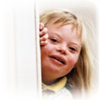 A downs syndrome child - A happy smiling downs syndrome child.