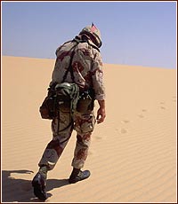 Soldier - A soldier in the sand, between a war in iraq.