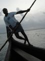 A boat in the lake of kerala - Kerala is a land of lakes and backwaters. here a man rowing a country boat