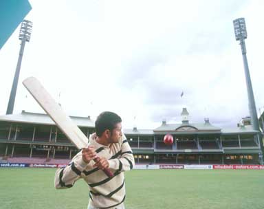 sachin with his bat - sachin checks his bat
